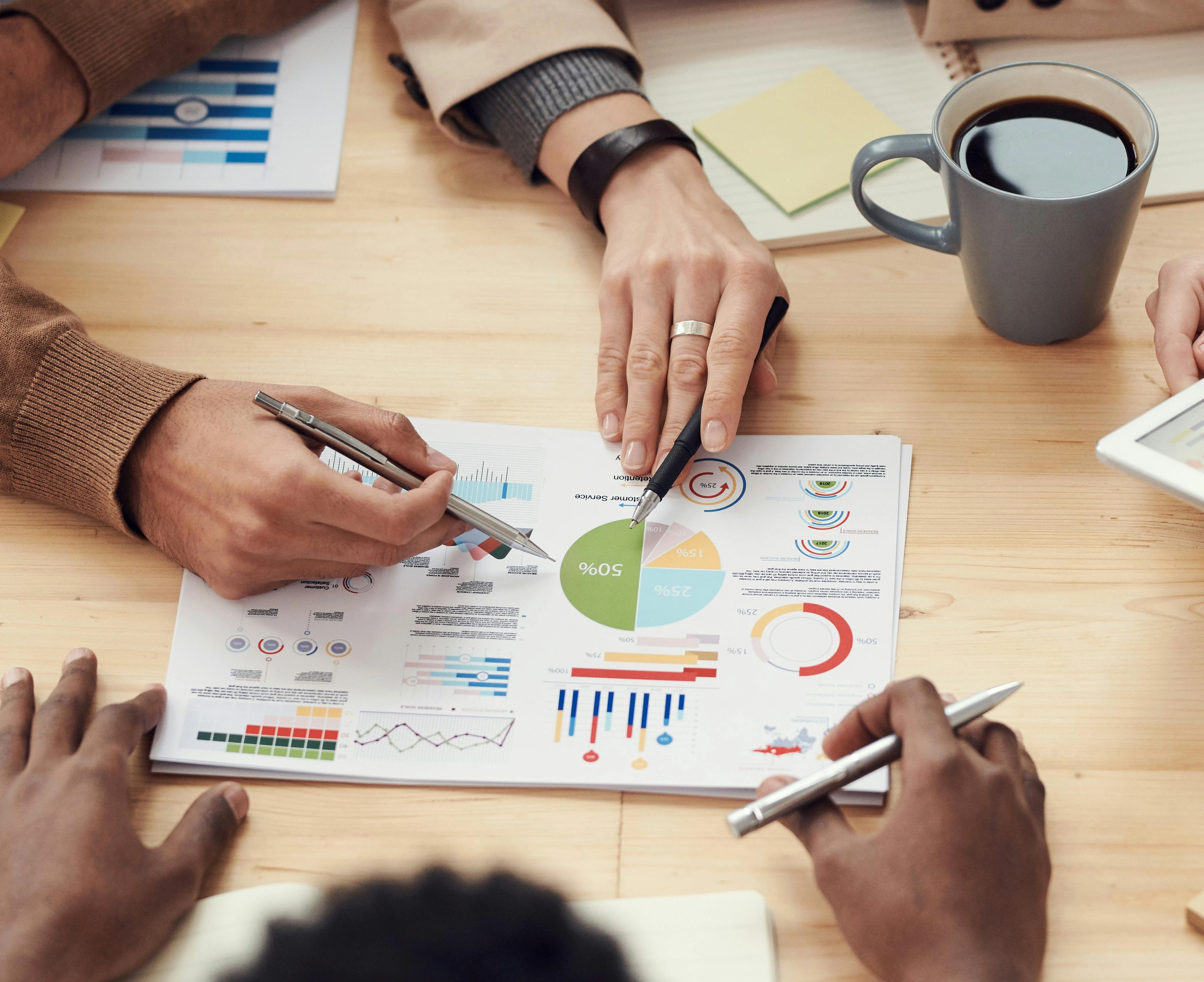 Portfolio manager analyzing investment charts for PMS solutions.