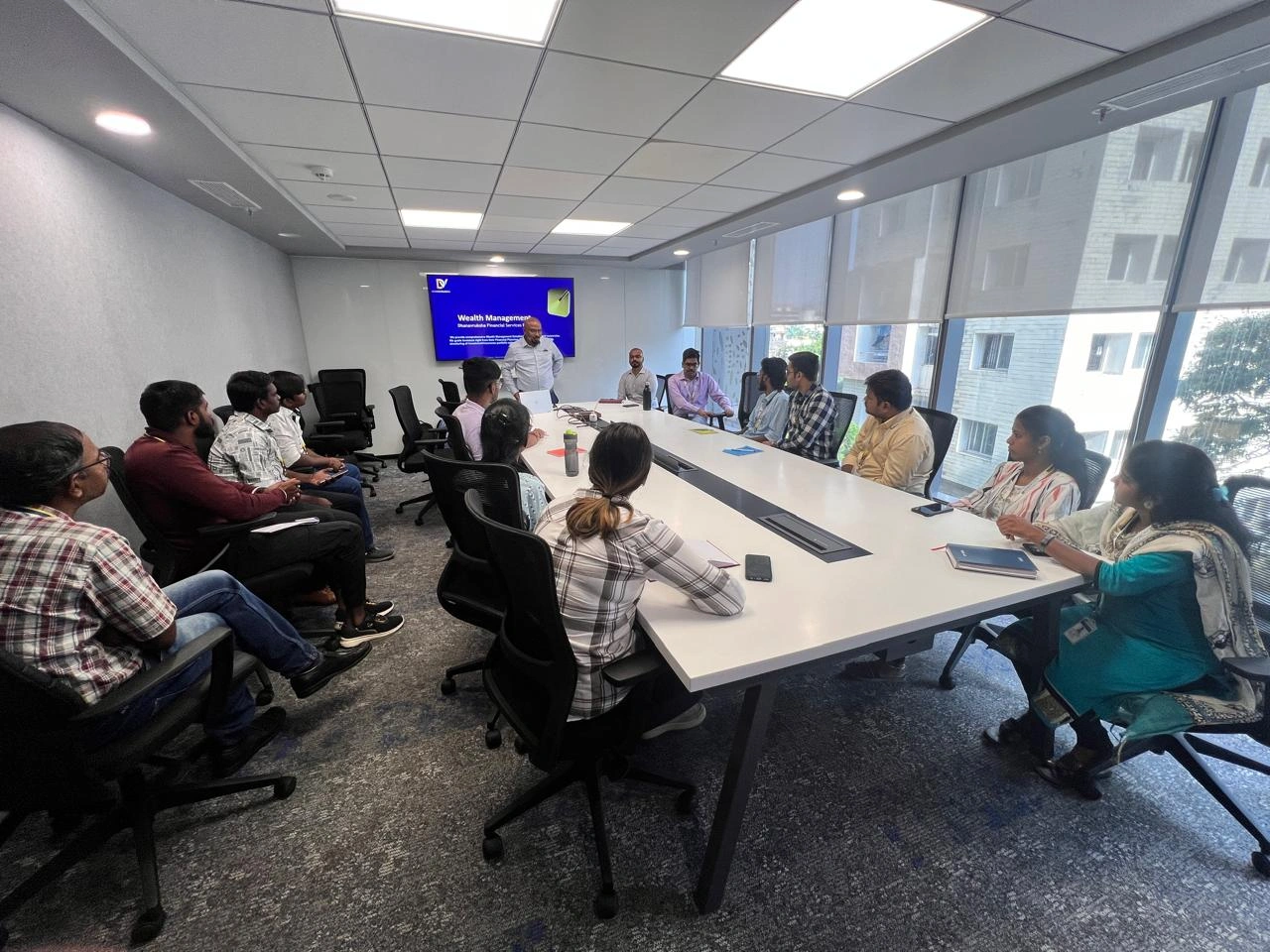 Image 2, Young adults learning about money management and investment strategies.