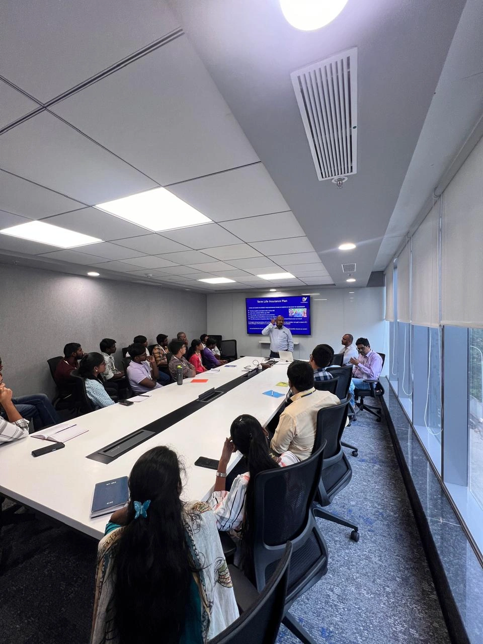 Image 3, Young adults learning about money management and investment strategies.